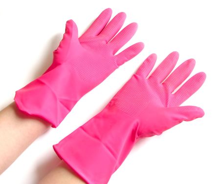 Pink rubber gloves on white backgroundの写真素材