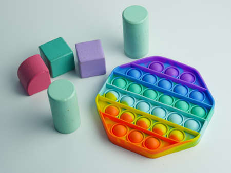hexagon  fidget toy and colorful cube blocks. isolated on a white backgroundの写真素材