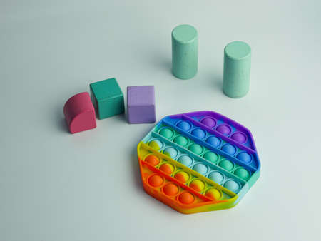 hexagon  fidget toy and colorful cube blocks. isolated on a white backgroundの写真素材