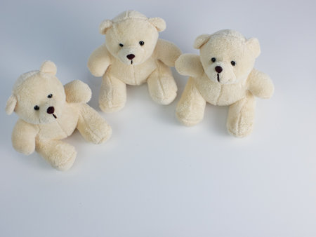 top view of three teddy bears isolated on a white backgroundの写真素材