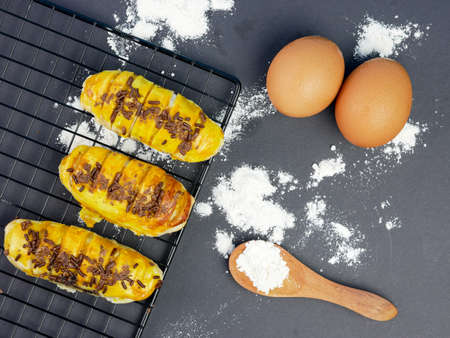 Bolen bread is a typical Indonesian bread, on a cooling rack with a black backgroundの写真素材