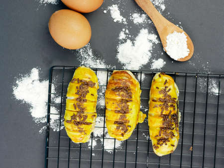 Bolen bread is a typical Indonesian bread, on a cooling rack with a black backgroundの写真素材