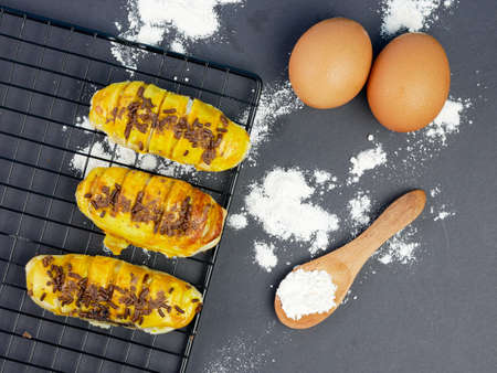 Bolen bread is a typical Indonesian bread, on a cooling rack with a black backgroundの写真素材