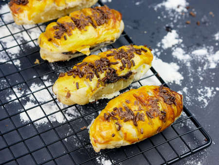 Bolen bread is a typical Indonesian bread, on a cooling rack with a black backgroundの写真素材