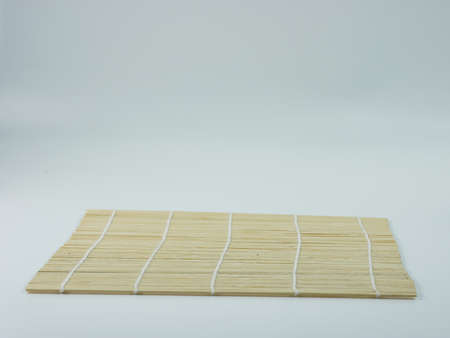 sushi rolling mat bamboo isolated on white background.の写真素材