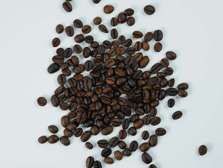 roasted coffee beans isolated on a white background.の写真素材