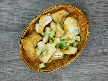 batagor or fried dumplings on a bamboo plateの写真素材