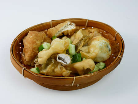 batagor or fried dumplings on a bamboo plateの写真素材