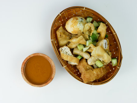 batagor or fried dumplings and peanut sauce isolated on white background.の写真素材