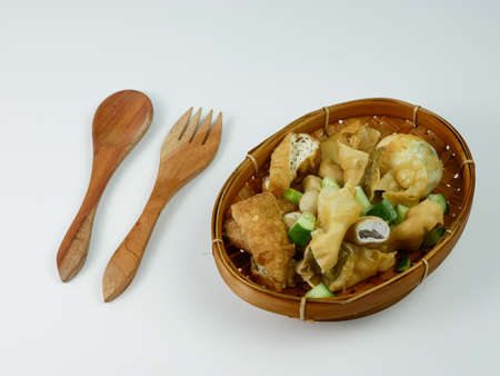 batagor or fried dumplings on a bamboo plateの写真素材