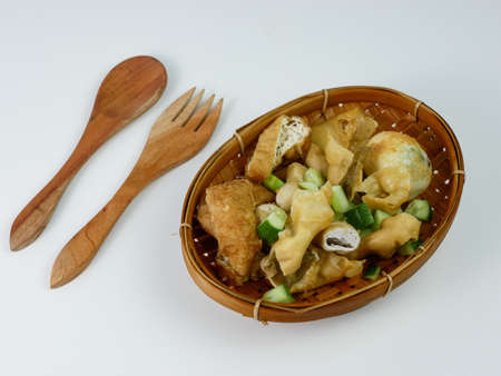 batagor or fried dumplings on a bamboo plateの写真素材