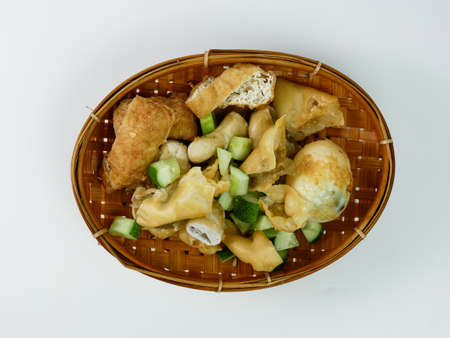 batagor or fried dumplings on a bamboo plateの写真素材