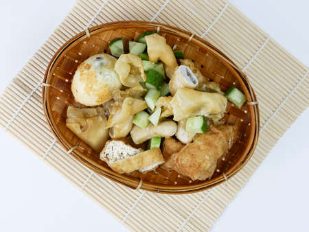 batagor or fried dumplings on a bamboo plateの写真素材