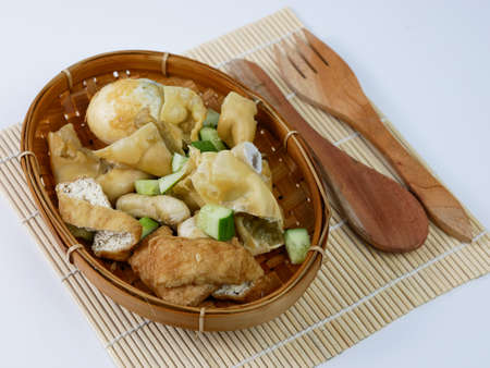batagor or fried dumplings on a bamboo plateの写真素材