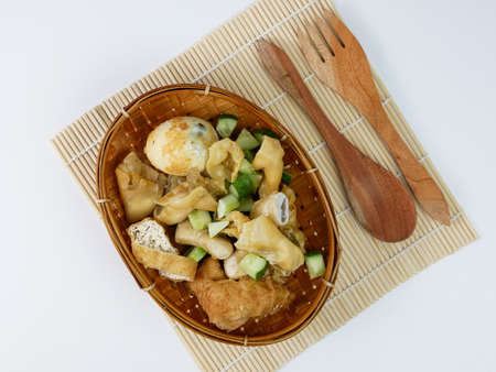 batagor or fried dumplings on a bamboo plateの写真素材