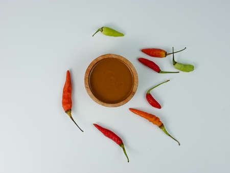 peanut sauce in a small wooden bowl isolated on white background.の写真素材