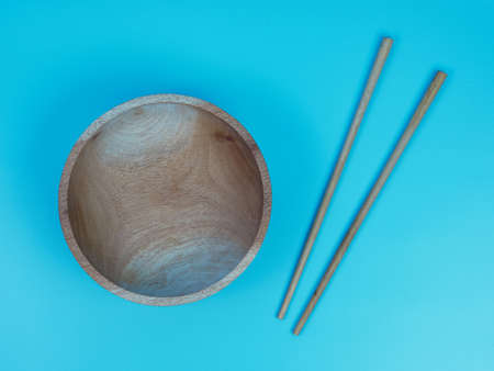 Empty wooden plate with chopsticks, cutlery. diet concept.の写真素材