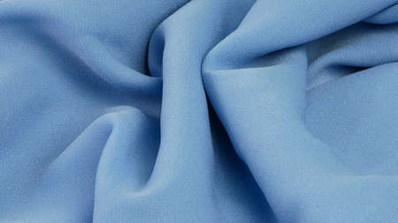baby blue fabric texture, wrinkled fabric as a background.の写真素材