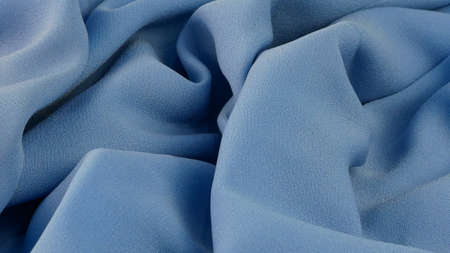 baby blue fabric texture, wrinkled fabric as a background.の写真素材