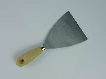 Scrapper or putty knife tool isolated on white background.の写真素材