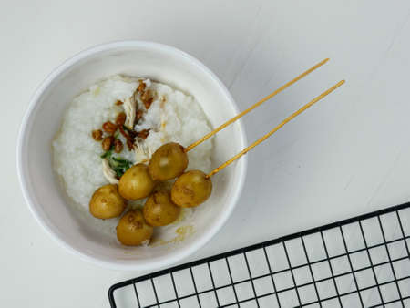 rice porridge in a bowl, on the table for breakfast in the morning.の写真素材