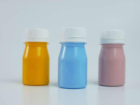 pigment resin paint in the bottle, many colors have pink, blue, and orange. isolated on a white background.の写真素材