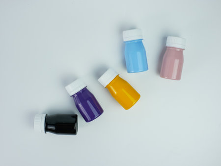 pigment resin paint in the bottle, many colors there are purple, pink, blue, orange, and black....