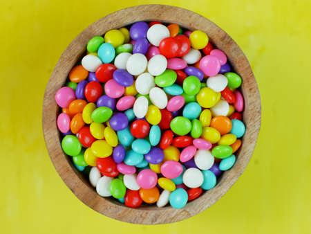 Top view of colorful sweet candy in small bowl. rainbow ball candy.の写真素材