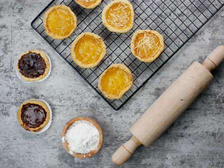 Pineapple, cheese and chocolate flavored pies on a cooling rack. bakery food concept.の写真素材