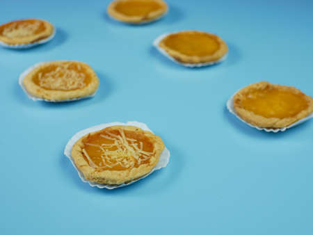 Pineapple and cheese flavored pie on blue backgroundの写真素材