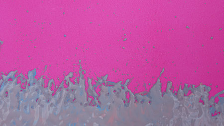 Pink and blue paint splashes on a pink background. Abstract background