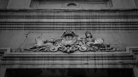 Ancient faces on the facadeの写真素材