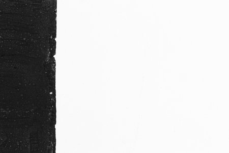 raw black texture with white planeの写真素材