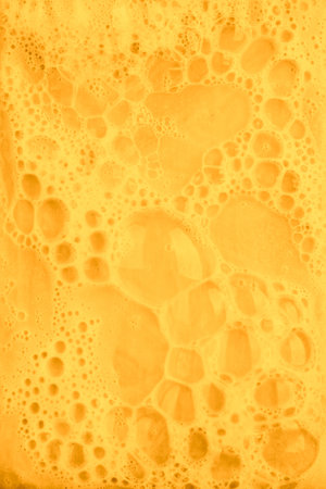 yellow foaming soap backgroundの写真素材