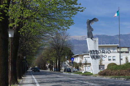 Town name and WWI memorial along entrance road to Vittorio Veneto, where the same battle was fought during World War I.のeditorial素材
