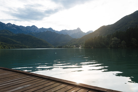 Barcis lake at sunset, with the village in the background. It was created in 1954 for the exploitation of hydroelectric power.の写真素材