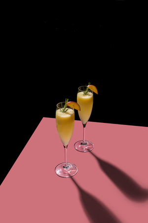 Bellini, a cocktail with Prosecco or champagne white peaches and sugar syrup, in a graphic pop contemporary styleの写真素材