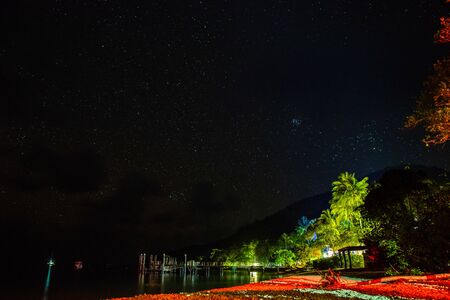 Starry night sky from Fitzroy Island beach, Queensland, Australiaの写真素材