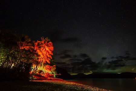 Starry night sky from Fitzroy Island beach, Queensland, Australiaの写真素材