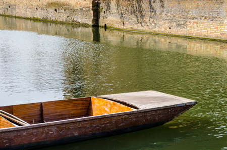 Close up of a single punt on river Cam in Cambridge, United Kingdomの写真素材