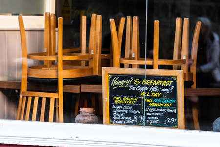 Window of an empty restaurant forced to close amid COVID-19 pandemicの写真素材