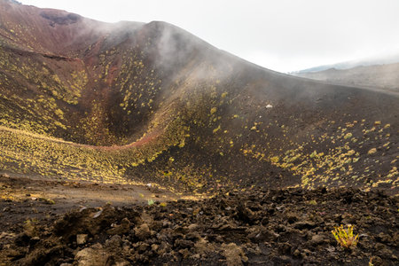 View of Etna volcano craters among the clouds near Rifugio Sapienza. Sicily, Italyの写真素材