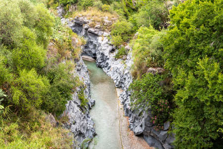 Basalt rocks and pristine water of Alcantara gorges in Sicily, Italyの写真素材