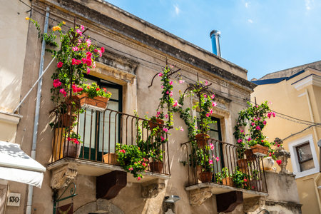 Typical Sicilian balcony in Taormina full of flowers and decorationsの写真素材