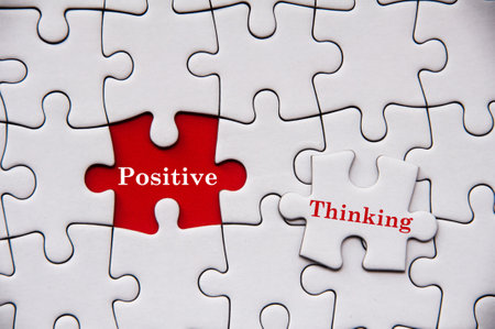 Positive thinking text on missing jigsaw puzzle. Motivational conceptの写真素材