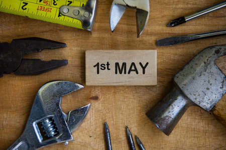 Text on wooden block - 1st May with working tools background. Labor day concept.の写真素材