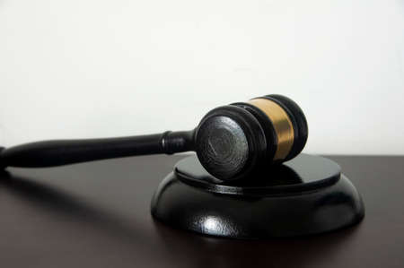 Lawyer gavel on wooden table with white background. Law conceptの写真素材