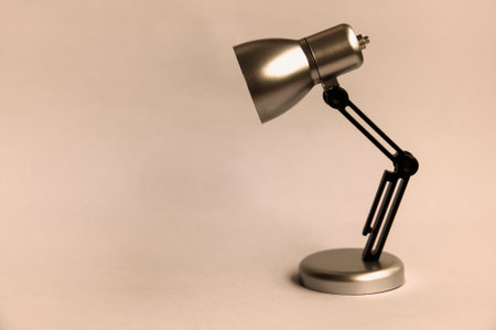Closeup black small lamp in vintage color background. Copy spaceの写真素材