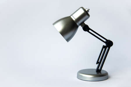 Closeup silver and black small lamp on white color background. Copy spaceの写真素材