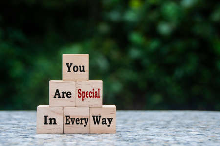 You are special in every way text on wooden blocks with blurred nature background. Motivational conceptの写真素材